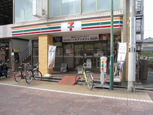 MCビル コンビ二：セブンイレブン 京成大久保駅前店　311m